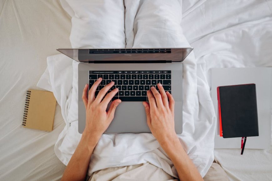 a minimalist wealthy person managing finances with laptop and documents in a cozy modern home office